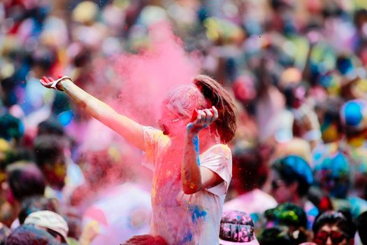 MALAYSIA, Kuala Lumpur: Revellers dance and spray colored powder during the Holi Festival in Kuala Lumpur on March 26, 2016. Holi, also called the Festival of Colours, is a popular Hindu spring festival observed in India, Malaysia and other countries at the end of the winter season on the last full moon day of the lunar month. 