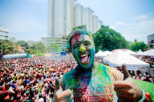 MALAYSIA, Kuala Lumpur: Revellers dance and spray colored powder during the Holi Festival in Kuala Lumpur on March 26, 2016. Holi, also called the Festival of Colours, is a popular Hindu spring festival observed in India, Malaysia and other countries at the end of the winter season on the last full moon day of the lunar month. 
