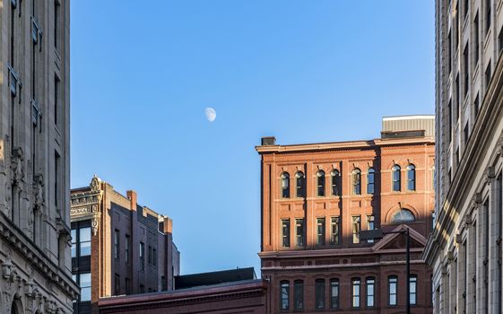 old brick building skyline with the moon in Portland, Maine