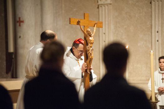 FRANCE, Lyon: Roman Catholic Cardinal, Archbishop of Lyon, Philippe Barbarin takes part in a Good Friday mass on March 25, 2016 in Saint-Jean cathedral in Lyon, central eastern France. Barbarin, accused of covering up the sexual abuse of children by priests apologised to victims during a mass on March 23, according to the website of his diocese. Barbarin, quoting Pope Francis, said on March 23 he was obliged to assume all the evil committed by some priests and personally apologise for the damage they have caused by sexually abusing children.