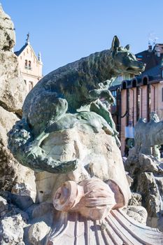 The fox, one of the four animals (with the capercaillie, the squirrel, the eagle) of the Faun Fountain in square Carli, Asiago, Italy.