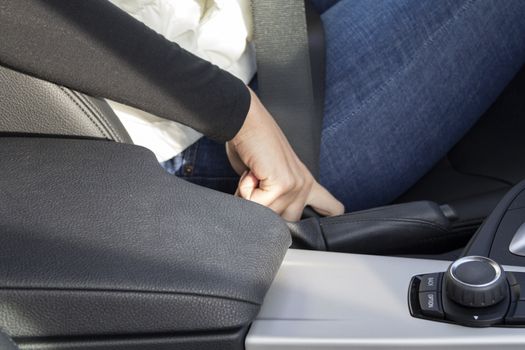 the girl in the car safety belt is strapped