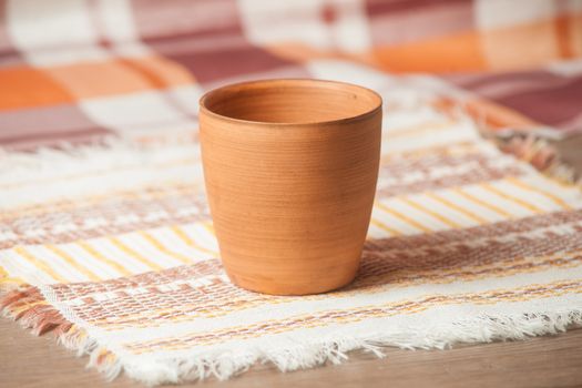 Traditional handcrafted mug on multycolor background. High resolution