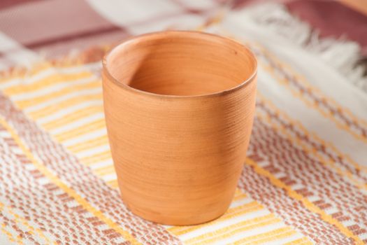 Traditional handcrafted mug on multycolor background. High resolution