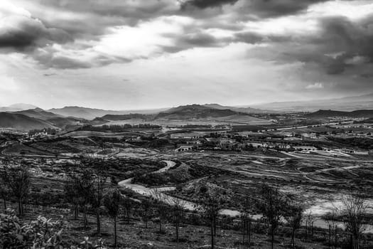 summer sunlight with cloudy sky and rural view in black and white