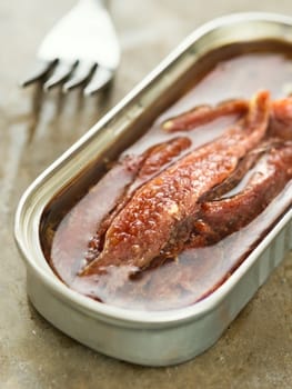 close up of canned salted anchovy fillet in oil