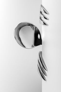 Spoon and two forks formed into conceptual figure
