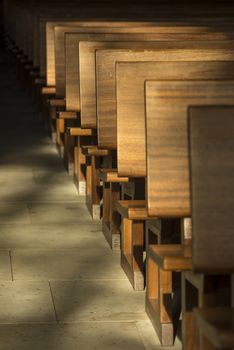 Pews in the morning light in a historic church in the Netherlands
