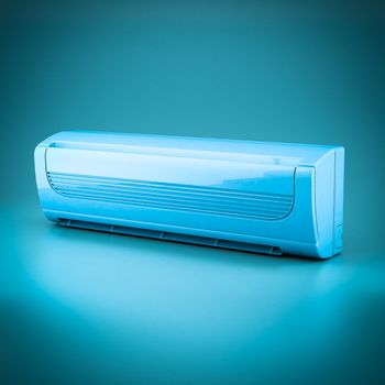 Image of modern air conditioner on a blue background