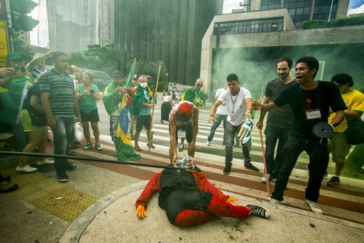 BRAZIL, Sao Paulo: Demonstrators destroy symbols of ruling party,  Workers' Party (PT) during a protest for the impeachment of President Dilma Rousseff, against former president Lula and against corruption in Petrobras scandal case in Sao Paulo, Brazil on March 26, 2016. Brazilian lawmakers relaunched impeachment proceedings against President Dilma Rousseff Thursday and a judge blocked her bid to bring her powerful predecessor into her cabinet, intensifying the political crisis engulfing her. 