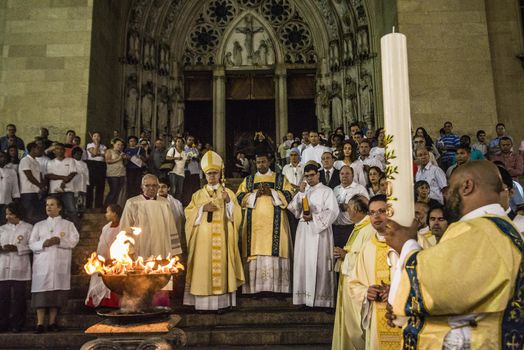BRAZIL, Sao Paulo: Cardinal Odilo Scherer, the archbishop of São Paulo, leads the Easter prayers as churchgoers attend Easter mass and vigil at São Paulo See Metropolitan Cathedral on March 26, 2016. Christians around the world are marking the Holy Week, commemorating the crucifixion of Jesus Christ, leading up to his resurrection on Easter.