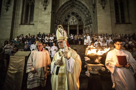 BRAZIL, Sao Paulo: Cardinal Odilo Scherer, the archbishop of São Paulo, leads the Easter prayers as churchgoers attend Easter mass and vigil at São Paulo See Metropolitan Cathedral on March 26, 2016. Christians around the world are marking the Holy Week, commemorating the crucifixion of Jesus Christ, leading up to his resurrection on Easter.