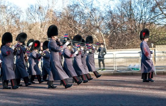 Musicians playing march on ceremony of changing of the guard in Buckingham Palace in London, United Kingdom