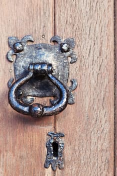 Old wooden door with lock and knob