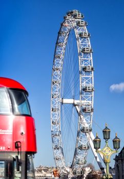 London Eye (135 m tall, diameter of 120 m), a famous tourist attraction over river Thames.