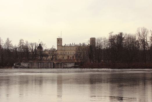 Gatchina Palace and the White Lake in the spring, in March 2016. Leningrad Region, Gatchina park.