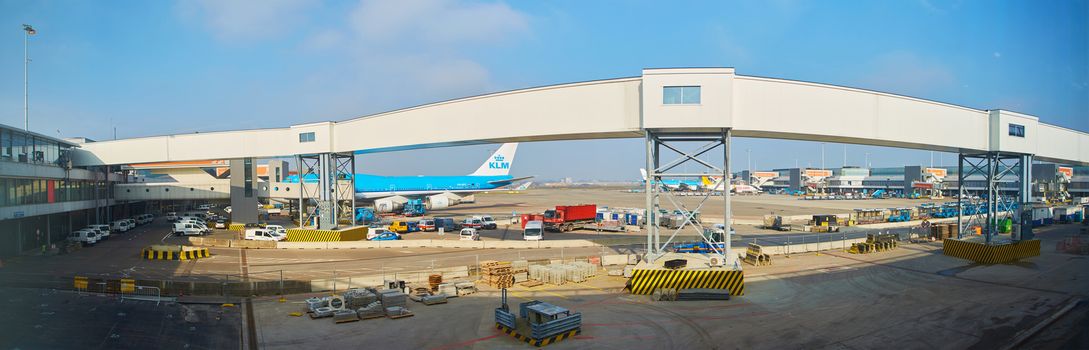 Amsterdam, Netherlands - March 11, 2016: KLM plane being loaded at Schiphol Airport