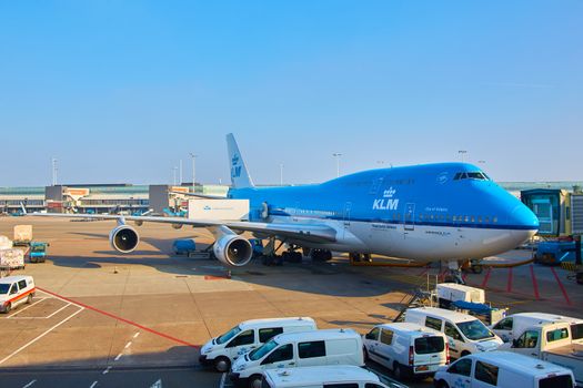 Amsterdam, Netherlands - March 11, 2016: KLM plane being loaded at Schiphol Airport