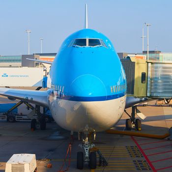 Amsterdam, Netherlands - March 11, 2016: KLM plane being loaded at Schiphol Airport