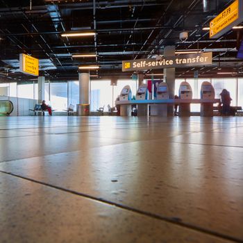 Amsterdam, Netherlands - March 11, 2016: self check-in kiosk in Amsterdam Airport Schiphol. Amsterdam Airport Schiphol is the main international airport of the Netherlands.