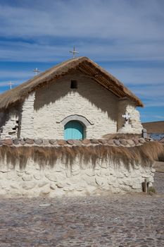 Historic church in the small village of Guallatire on the Altiplano in the Arica y Parinacota Region of Chile. The village sits at the base of the active Guallatire Volcano.