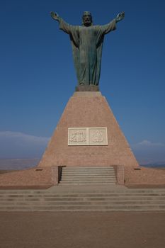 Statue of Christ on the top of the Morro de Arica, a cliff that towers above the port city of Arica in Chile.