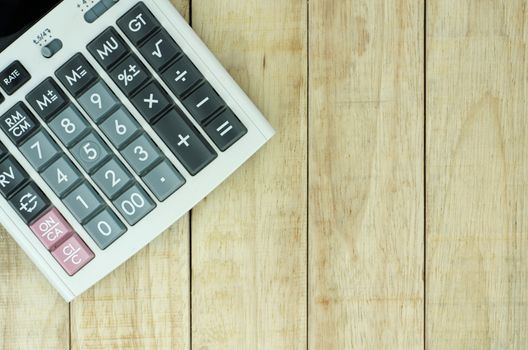 Calculator on wood pattern background