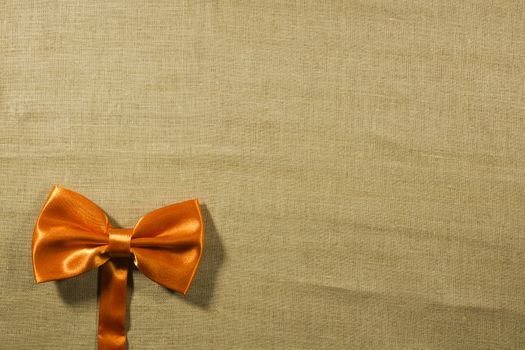 Bow tie on a background of white linen napkins