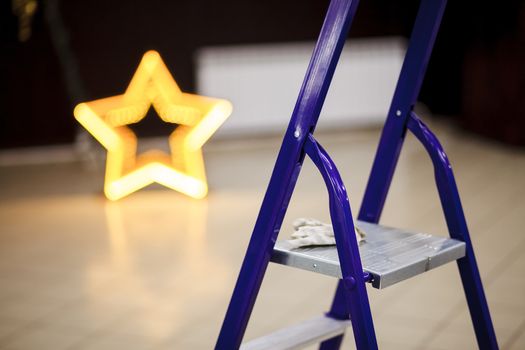 Step ladder closeup, decorating the banquet hall of the event.