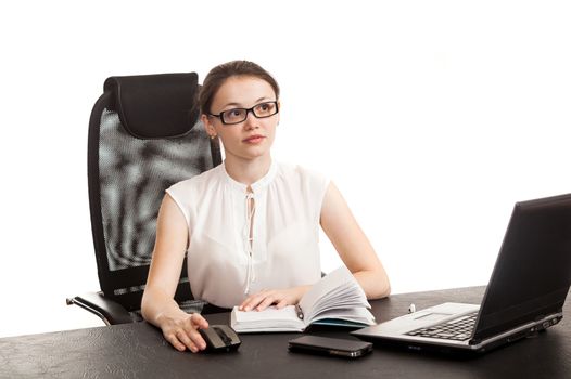 the business woman sits at office table with the laptop