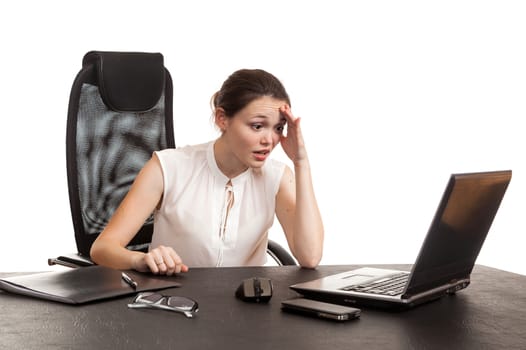 the business woman sits at office table with the laptop