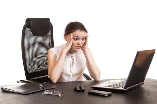 the business woman sits at office table with the laptop