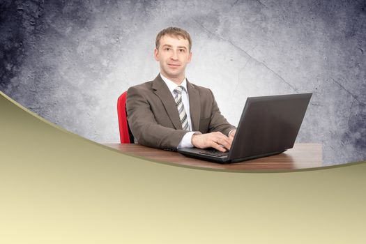 Businessman with laptop looking at camera, business concept