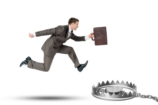 Running businessman with bear trap isolated oon white background