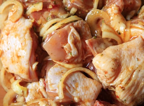 Pieces of raw chicken in sauce with vegetables marinated barbecue
