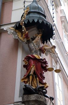 Saint Michael street statue in Salzburg, Austria