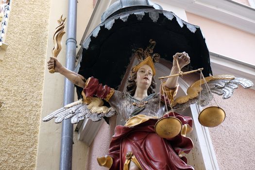 Saint Michael street statue in Salzburg, Austria