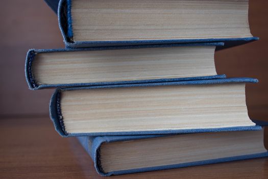 stack of books on the wooden table