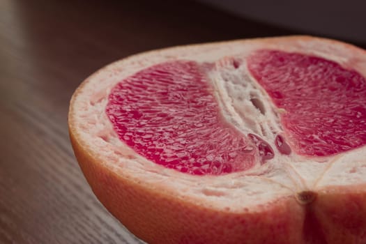 fresh juicy grapefruit on a wooden table