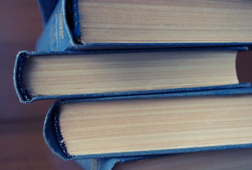 stack of books on the wooden table