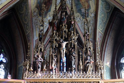Crucifixion, Main altar in Parish church in St. Wolfgang on Wolfgangsee in Austria