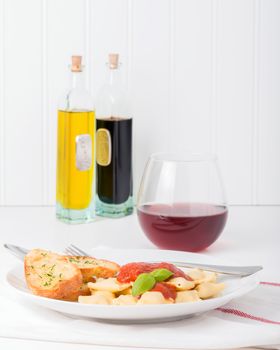 Ravioli filled with ricotta cheese and basil served with toasts and wine.