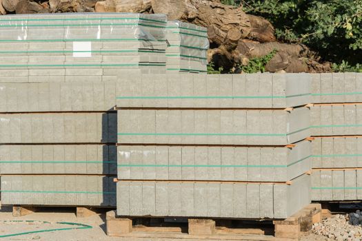 Cobblestones on a wooden plate on a construction site.