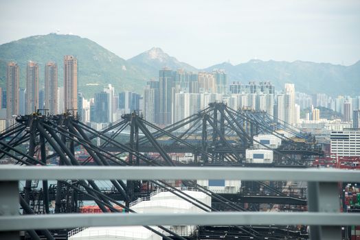 Hong Kong International Terminal Harbour,Large port crane and cityscape in Hong Kong harbour , Hong Kong