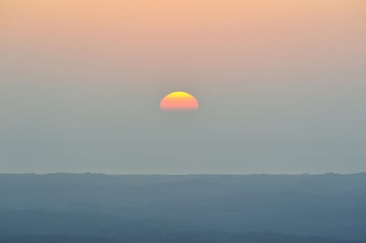 Half orange sun on gradient sky in Nicaragua