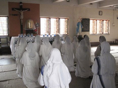 Sisters of Mother Teresa's Missionaries of Charity in prayer in the chapel of the Mother House, Kolkata, India