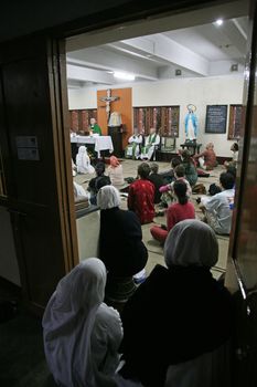 Sisters of The Missionaries of Charity of Mother Teresa at Mass in the chapel of the Mother House, Kolkata, India