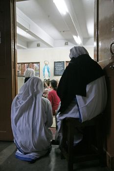 Sisters of The Missionaries of Charity of Mother Teresa at Mass in the chapel of the Mother House, Kolkata, India