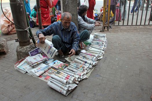 News dealer. The language of most magazines is Bengoli, the language of West Bengal, of which Kolkata is the capital, on November 28, 2012 in Kolkata, India