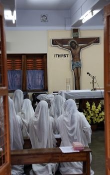 Sisters of Mother Teresa's Missionaries of Charity in prayer in the chapel of the Mother House, Kolkata, India